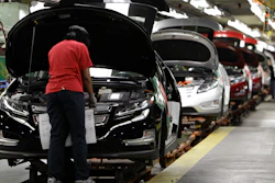 In this July 27, 2011, file photo, assembly worker Julaynne Trusel works on a Chevrolet Volt at the General Motors Hamtramck Assembly plant in Hamtramck, Mich.