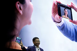 Huawei CEO Richard Yu displays the new Mate X foldable 5G smartphone at the Mobile World Congress in Barcelona, Sunday, Feb. 24, 2019.