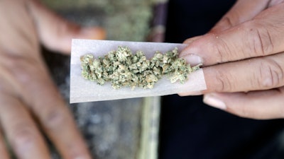 In this Nov. 9, 2016, file photo, a marijuana joint is rolled in San Francisco.