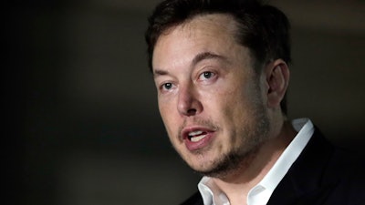 In this June 14, 2018, file photo, Tesla CEO Elon Musk speaks at a news conference in Chicago.