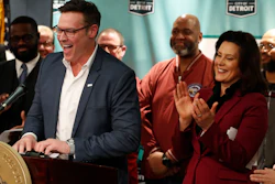 Fiat Chrysler COO Mark Stewart stands with Michigan Gov. Gretchen Whitmer during a news conference in Detroit, Tuesday, Feb. 26, 2019.