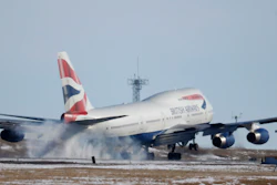 In this file photo taken Monday, Feb. 8, 2016, a British Airways plane touches down at Denver International Airport.