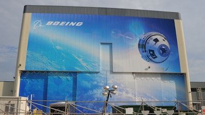 A CST-100 Starliner depicted on Boeing’s facility at Kennedy Space Center, Fla.