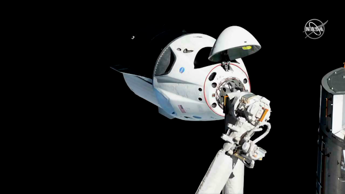 The SpaceX Crew Dragon is pictured about 20 meters away from the International Space Station’s Harmony module, Sunday, March 3, 2019.