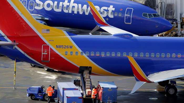 In this Feb. 5, 2019, file photo, Southwest Airlines planes are loaded at Seattle-Tacoma International Airport.