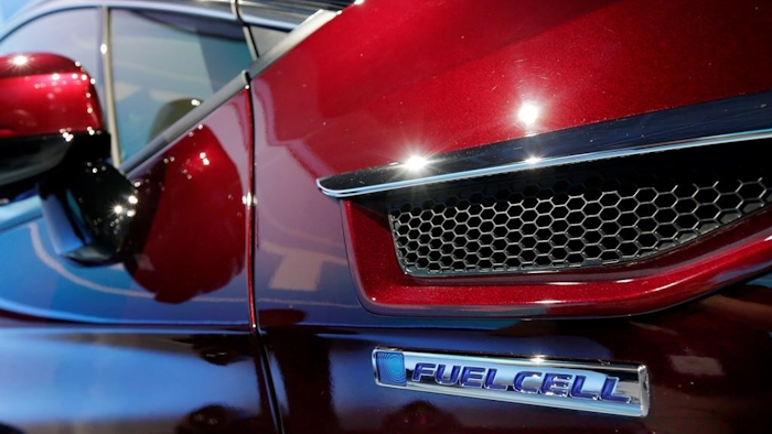 The fuel cell logo adorns the fender of a Honda Clarity at a media preview at the New York International Auto Show on Wednesday, April 12, 2017.