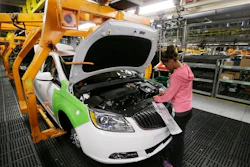 In this Monday, June 22, 2015, file photo, final trim is installed on a Buick Verano at the Orion Assembly in Orion Township, Mich.