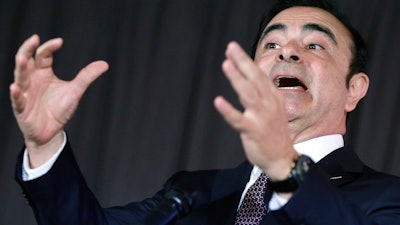 In this May 12, 2016, photo, then-Nissan Motor Co. President and CEO Carlos Ghosn speaks during a press conference in Yokohama.