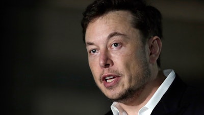 In this June 14, 2018, file photo, Tesla CEO Elon Musk speaks at a news conference in Chicago.