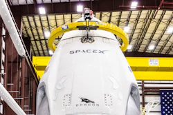 In this Dec. 18, 2018, photo, SpaceX's Crew Dragon spacecraft and Falcon 9 rocket are positioned inside the company's hangar at NASA's Kennedy Space Center.