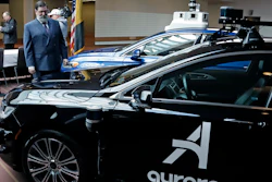 Pittsburgh Mayor William Peduto checks out autonomous vehicles designed by Aurora Innovations and Argo AI after signing an executive order Monday, March 4, 2019.