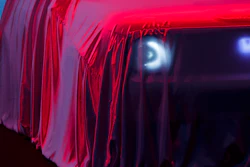 The new Honda 'E' concept car is veiled with a red dustsheet during the press day at the 89th Geneva International Motor Show in Switzerland, Tuesday, March 05, 2019.
