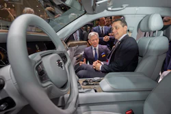 Foreign Minister Ignazio Cassis sits in an Aurus Senat car during the opening of the 89th Geneva International Motor Show in Switzerland, Thursday, March 7, 2019.