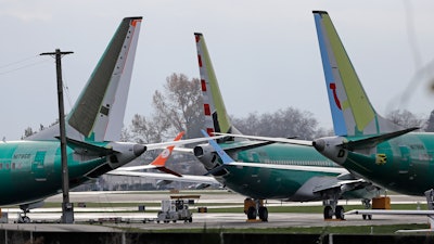 In this Nov. 14, 2018, file photo, Boeing 737 MAX 8 planes are parked near Boeing Co.'s 737 assembly facility in Renton, Wash.
