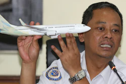 In this Nov. 28, 2018, file photo, National Transportation Safety Committee investigator Nurcahyo Utomo holds a model of an airplane during a press conference in Jakarta.