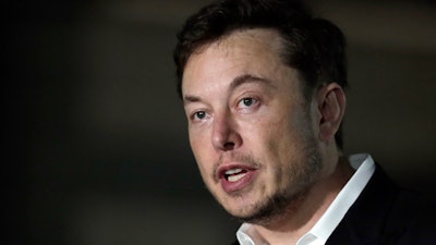 In this June 14, 2018, file photo, Tesla CEO Elon Musk speaks at a news conference in Chicago.