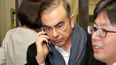 In this March 12, 2019, photo, former Nissan Chairman Carlos Ghosn leaves his lawyer's office in Tokyo.