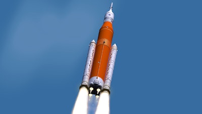 This illustration made available by NASA shows the Space Launch System during liftoff. On Wednesday, March 13, 2019, NASA's top official said the space agency's new rocket won't be ready for a moon shot next year.