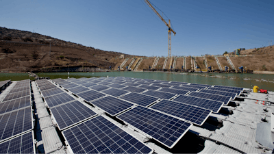 An island of solar panels floats in a pond at the Los Bronces mining plant, about 65 kilometers (approximately 40 miles) from Santiago, Chile, Thursday, March 14, 2019. The island of solar panels could give purpose to mine refuse in Chile by using them to generate clean energy and reduce water evaporation.