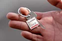 In this March 21, 2018, file photo, a Lion Air employee displays a ceremonial key to the company's newest plane following a delivery ceremony in Seattle.