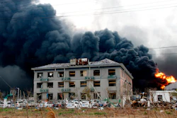 In this Thursday, March 21, 2019, photo, fires burn at the site of a factory explosion in a chemical industrial park in Yancheng, Jiangsu province.