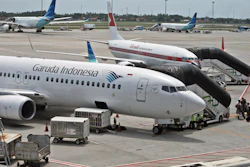 In this April 28, 2017, file photo, Garuda Indonesia planes are parked on the apron at the Soekarno-Hatta International Airport in Tangerang, Indonesia.