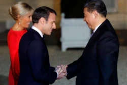 French President Emmanuel Macron and his wife Brigitte Macron welcome Chinese President President Xi Jinping prior to a state dinner at the Elysee Palace in Paris, Monday, March 25, 2019.