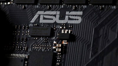 This Feb. 23, 2019, photo shows the inside of a computer with the ASUS logo in Jersey City, N.J.