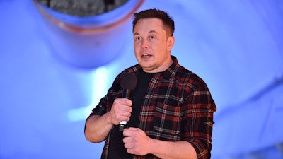 In this Tuesday, Dec. 18, 2018, file photo, Elon Musk speaks during an unveiling event for the Boring Co. test tunnel in Hawthorne, Calif.