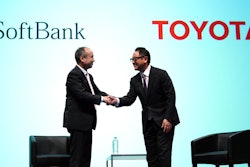 In this Oct. 4, 2018, file photo, Softbank Group Corp. Chairman Masayoshi Son, left, and Toyota Motor Corp. President Akio Toyoda shake hands after a press conference in Tokyo.
