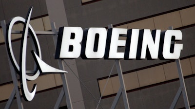 In this Jan. 25, 2011 file photo, the Boeing Company logo on its property in El Segundo, Calif.