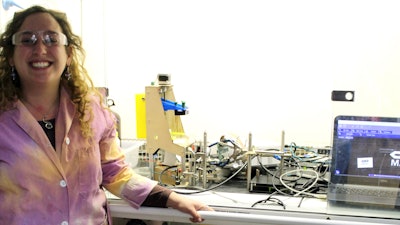 Graduate student Johanna Schwartz next to the multi-material printing setup that she built.