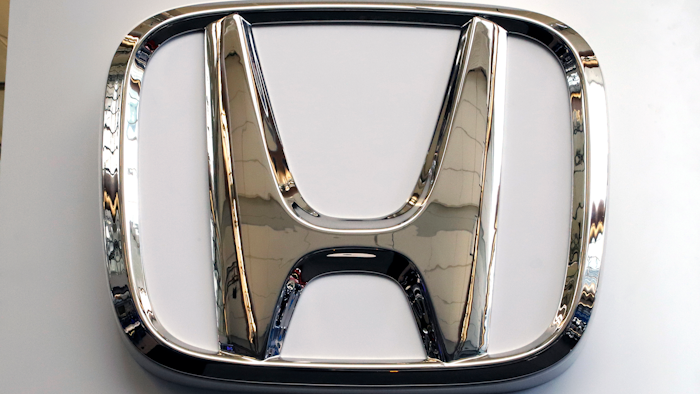 This Feb. 14, 2019, file photo shows a Honda logo on a 2019 Honda Civic at the 2019 Pittsburgh International Auto Show.