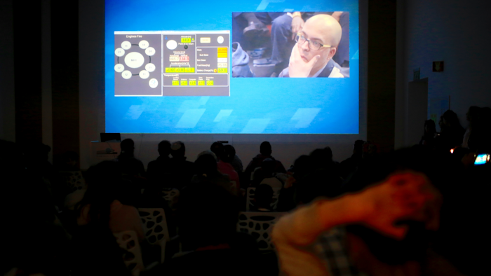 People watch the live broadcast of the SpaceIL spacecraft as it lost contact with Earth in Netanya, Thursday, April 11, 2019.