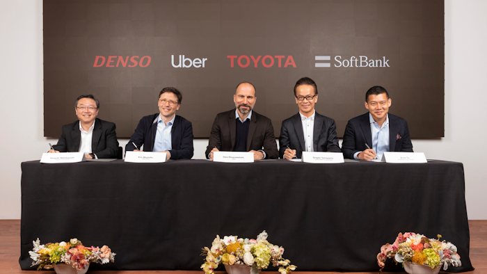 In this Thursday, April 18, 2019, photo, executives attend a press conference at Uber headquarters in San Francisco.