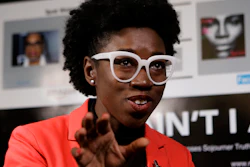 In this Feb. 13, 2019, photo, Massachusetts Institute of Technology facial recognition researcher Joy Buolamwini takes questions from reporters at the school in Cambridge, Mass.
