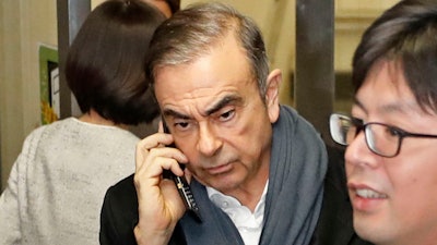 In this March 12, 2019, photo, former Nissan Chairman Carlos Ghosn leaves his lawyer's office in Tokyo.