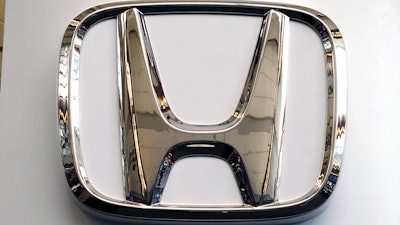 This Feb. 14, 2019, file photo shows a Honda logo on a 2019 Honda Civic at the 2019 Pittsburgh International Auto Show.