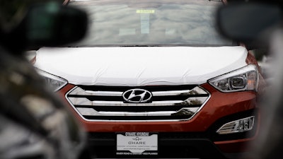 This Oct. 4, 2012, file photo shows a Hyundai Sonata at a Hyundai car dealership in Des Plaines, Ill.