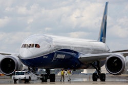 In this March 31, 2017, file photo, Boeing employees walk the new 787-10 Dreamliner down towards the delivery ramp area at the company's facility in South Carolina.