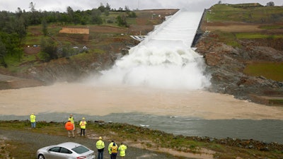 Water flows down the Oroville Dam spillway in Oroville, Calif., Tuesday, April 2, 2019.