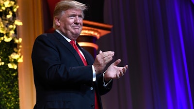 President Donald Trump arrives to speak at the National Republican Congressional Committee's annual spring dinner in Washington, April 2, 2019.