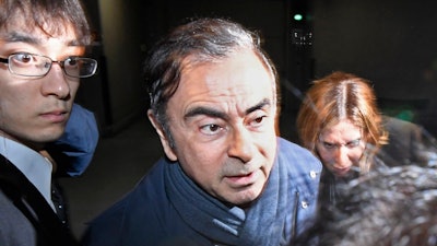 In this April 3, 2019, file photo, former Nissan Chairman Carlos Ghosn leaves his lawyer's office in Tokyo.