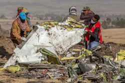 In this March 11, 2019, file photo, rescuers work at the scene of an Ethiopian Airlines flight crash near Bishoftu, Ethiopia.