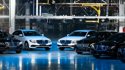 Cars displayed during an opening ceremony of the Mercedes Benz automobile assembly plant outside Moscow, Wednesday, April 3, 2019.