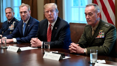 President Donald Trump, acting Defense Secretary Patrick Shanahan and Chairman of the Joint Chiefs of Staff Gen. Joseph Dunford during a meeting in the Cabinet Room of the White House, Wednesday, April 3, 2019.