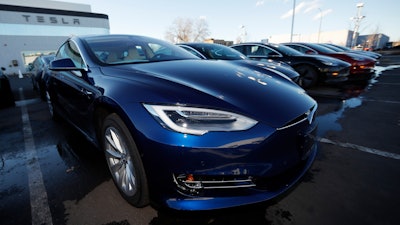 In this Sunday, Feb. 3, 2019, file photo, an unsold 2019 S75D sits at a Tesla dealership in Littleton, Colo.