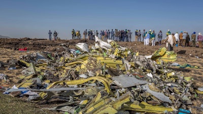 In this March 11, 2019, file photo, wreckage is piled at the crash scene of an Ethiopian Airlines flight crash near Bishoftu, Ethiopia.