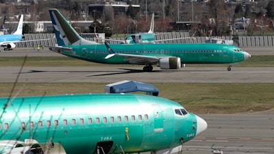In this March 22, 2019, file photo, a Boeing 737 Max 8 taxis before takeoff from Renton Municipal Airport in Renton, Wash.