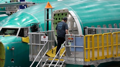 In this March 27, 2019, file photo a Boeing 737 MAX 8 airplane is shown on the assembly line during a brief media tour of Boeing's 737 assembly facility in Renton, Wash.